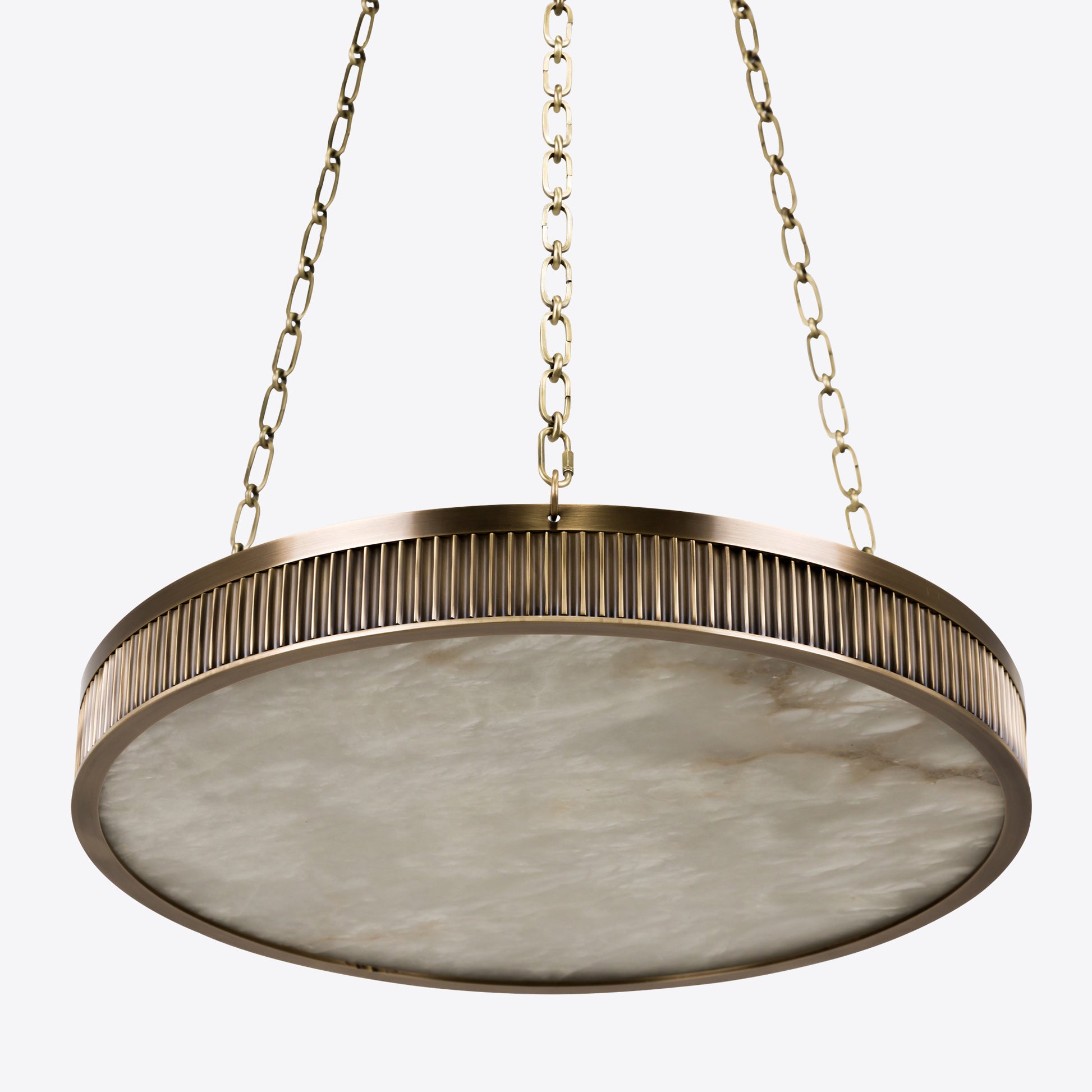 Luxury alabaster pendant light with brushed brass frame and chain suspension