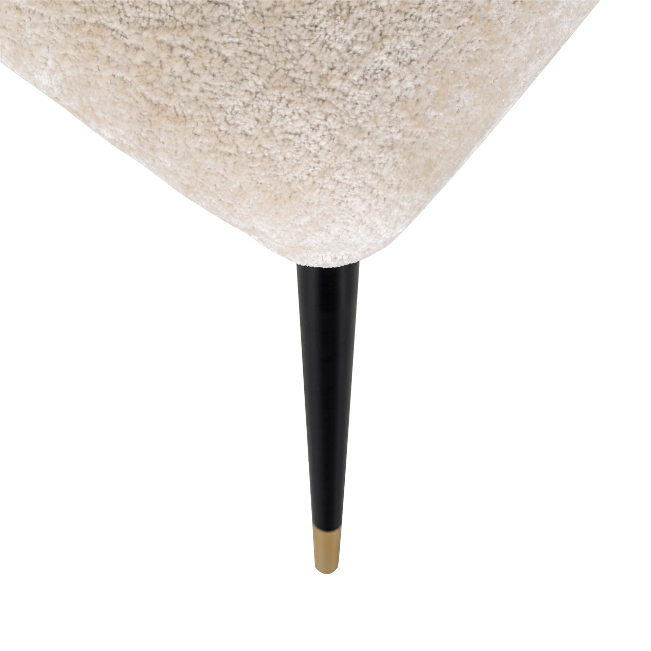 Contemporary dining chair in cream upholstery with black and gold legs
