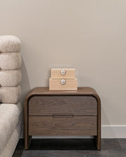 Modern curved wooden end table with 2 drawers in warm brown finish