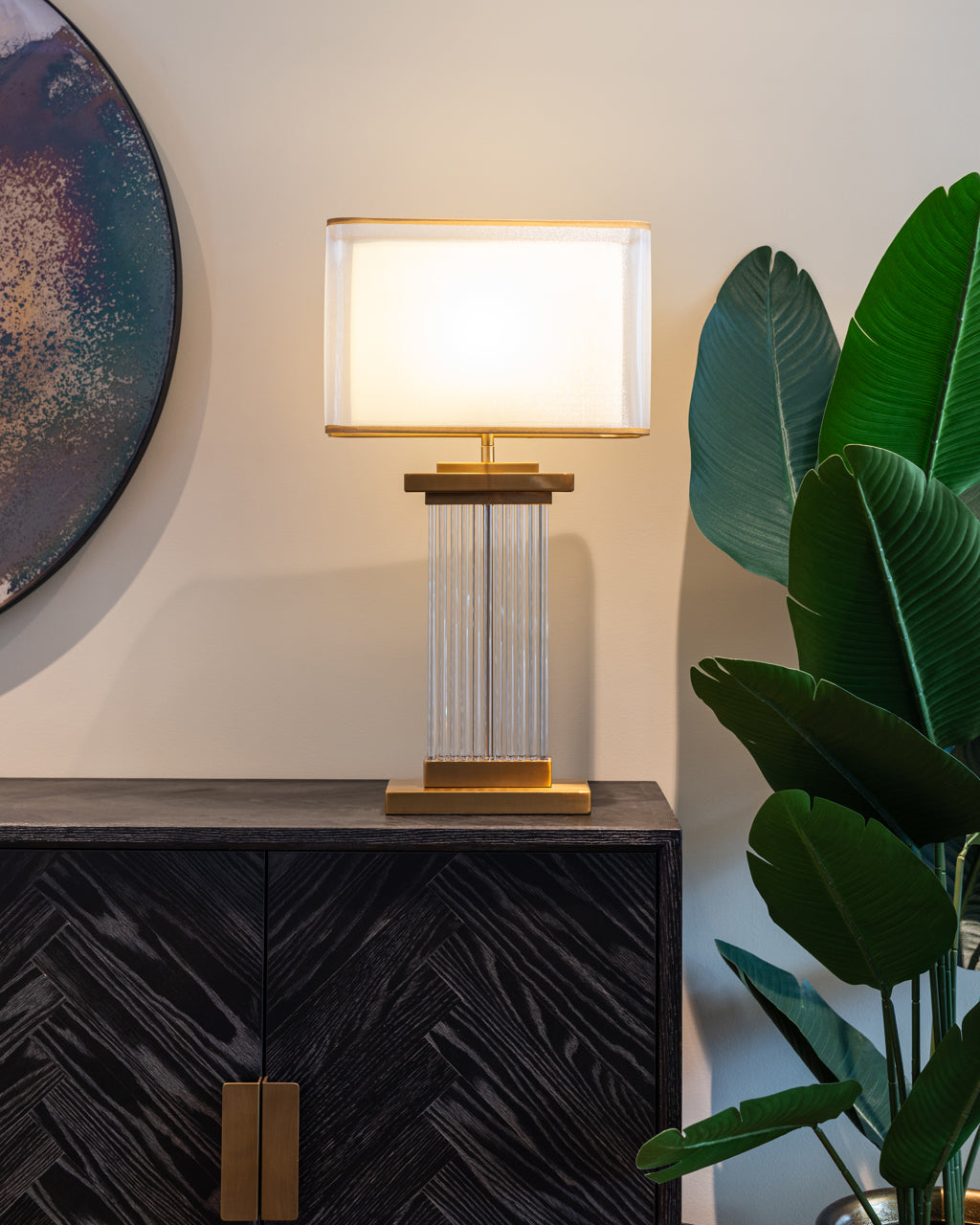 Modern black wood sideboard cabinet with brass handles and storage shelves.
