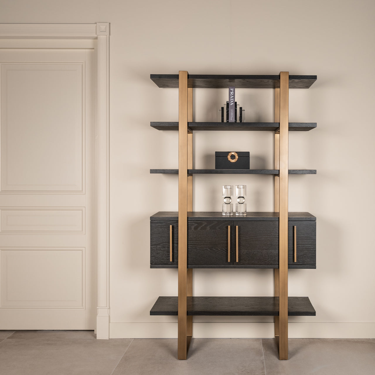 dark coffee wood with brass accents and open display shelves