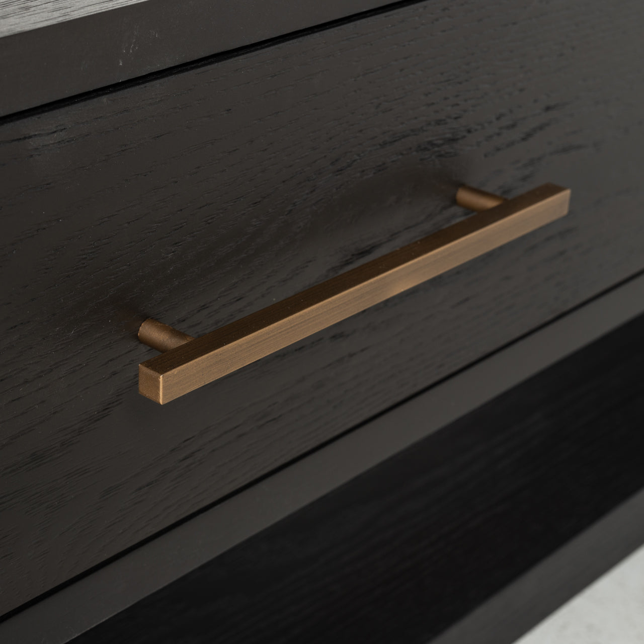 Dark wood and gold media unit with storage drawers 