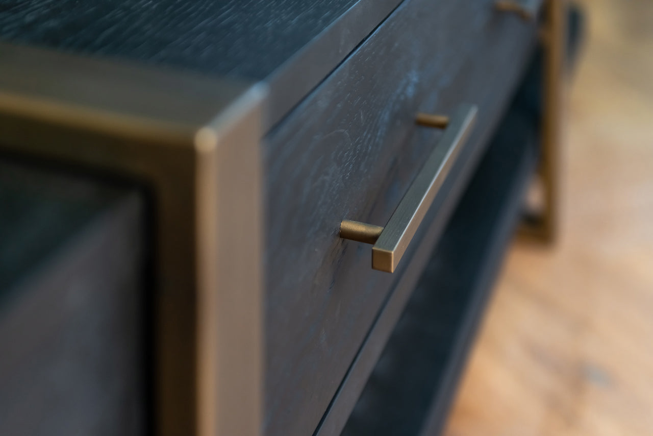 Dark wood and gold media unit with storage drawers 