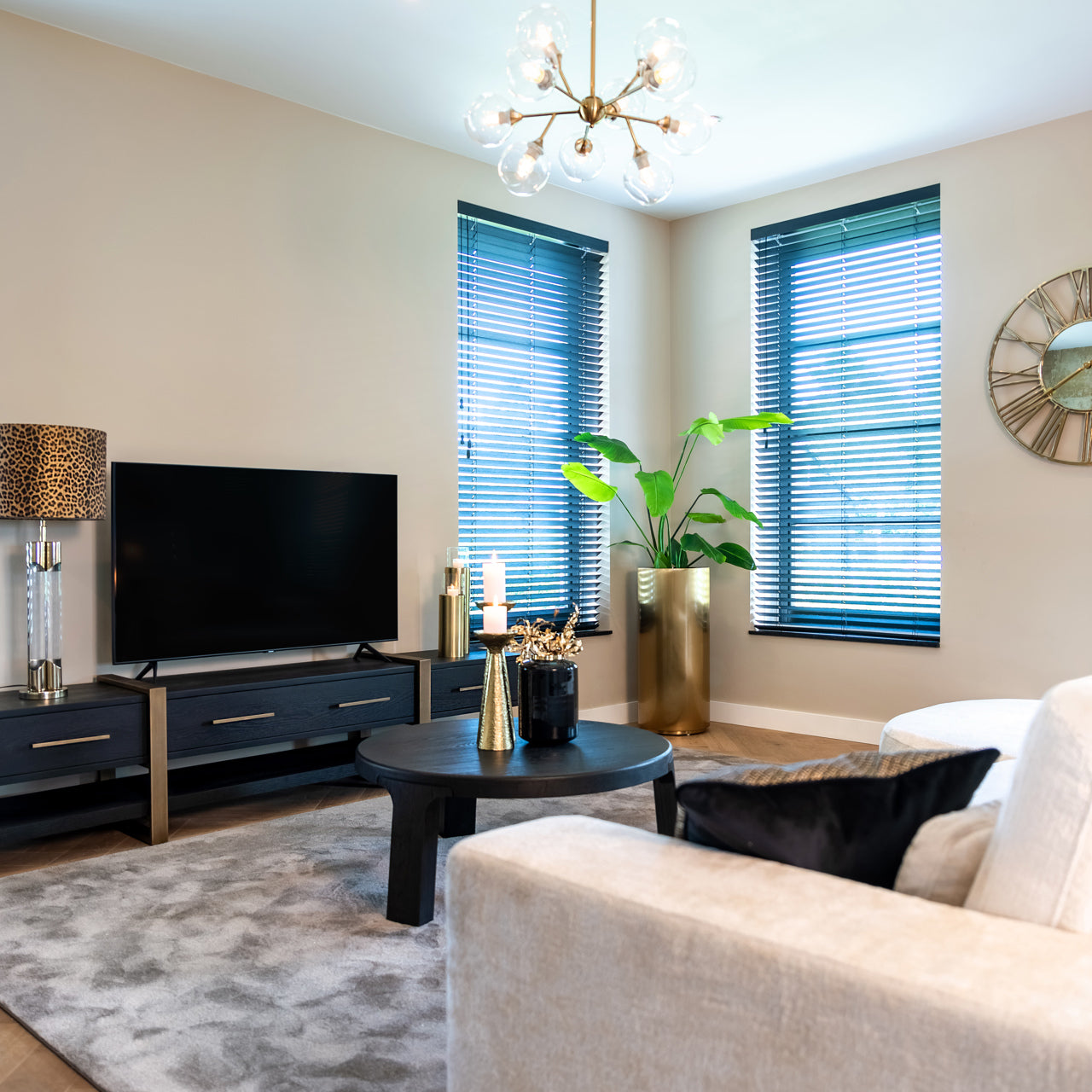Dark wood and gold media unit with storage drawers 