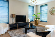 Dark wood and gold media unit with storage drawers 