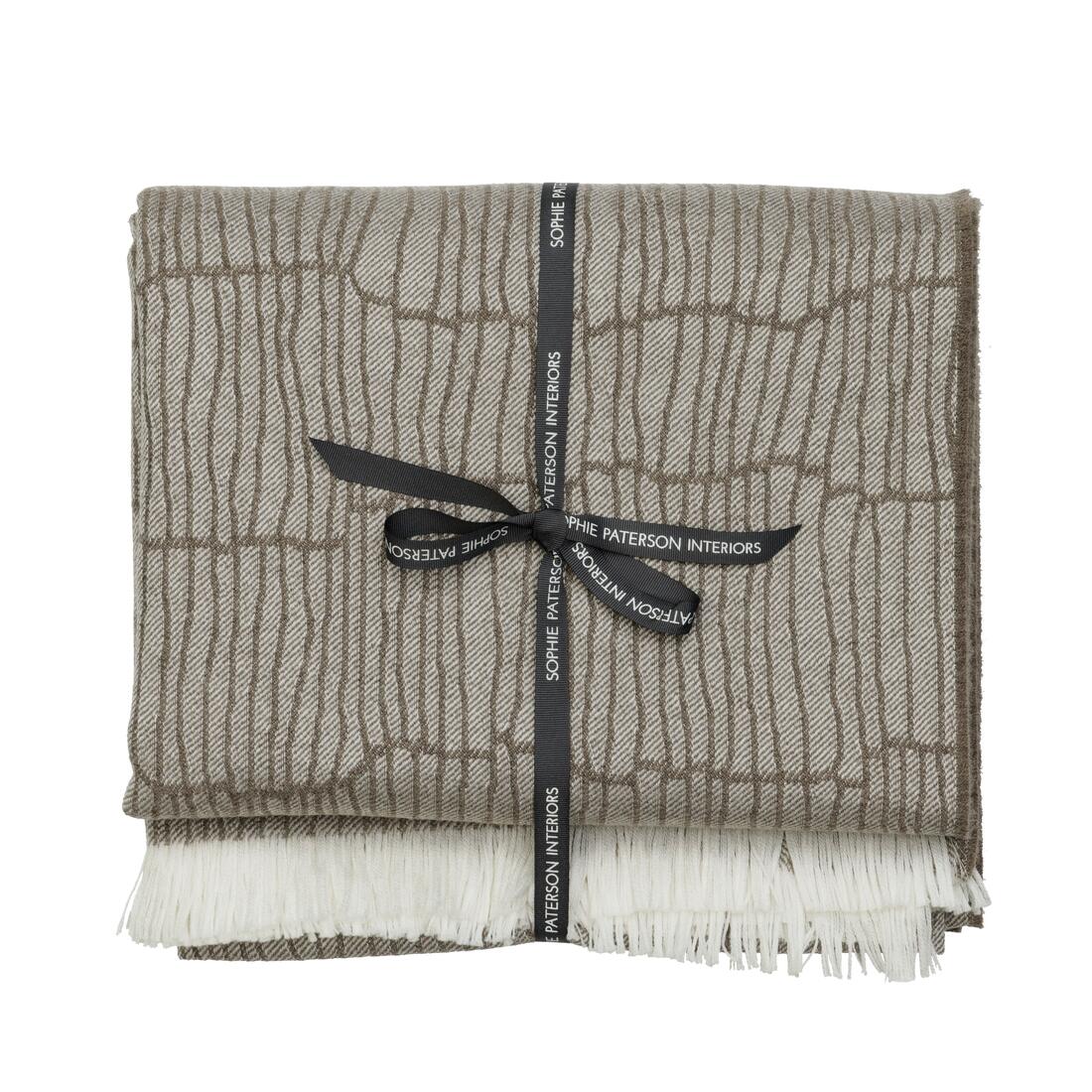 Andrew Martin tan Merino wool throw with geometric pattern and fringe