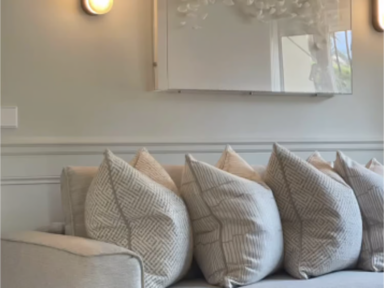 Luxury beige and ivory cushion with a textured geometric diamond weave and soft piped trim.