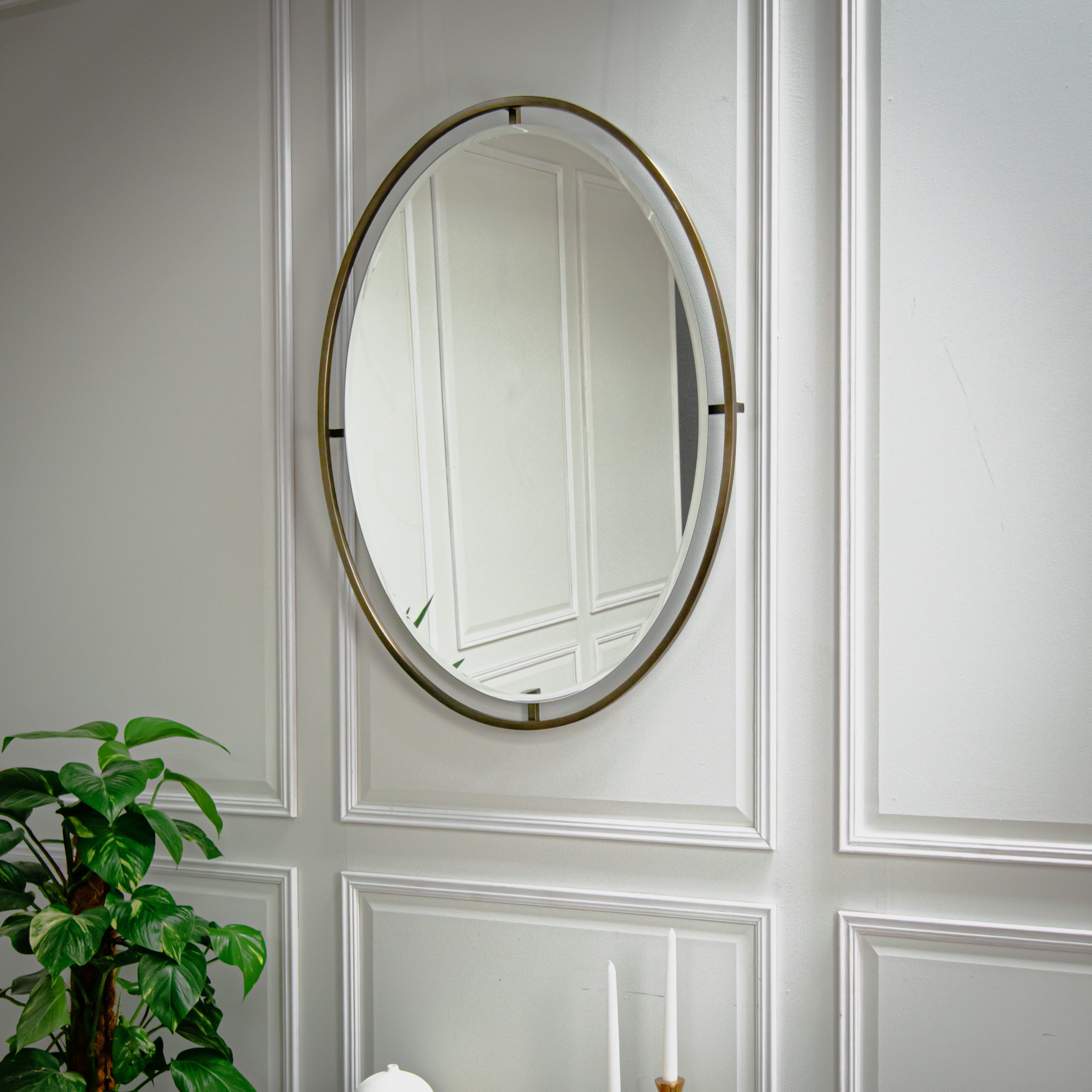 Minimalist round accent mirror with gold metal frame