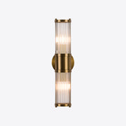 Brushed brass wall light with fluted glass