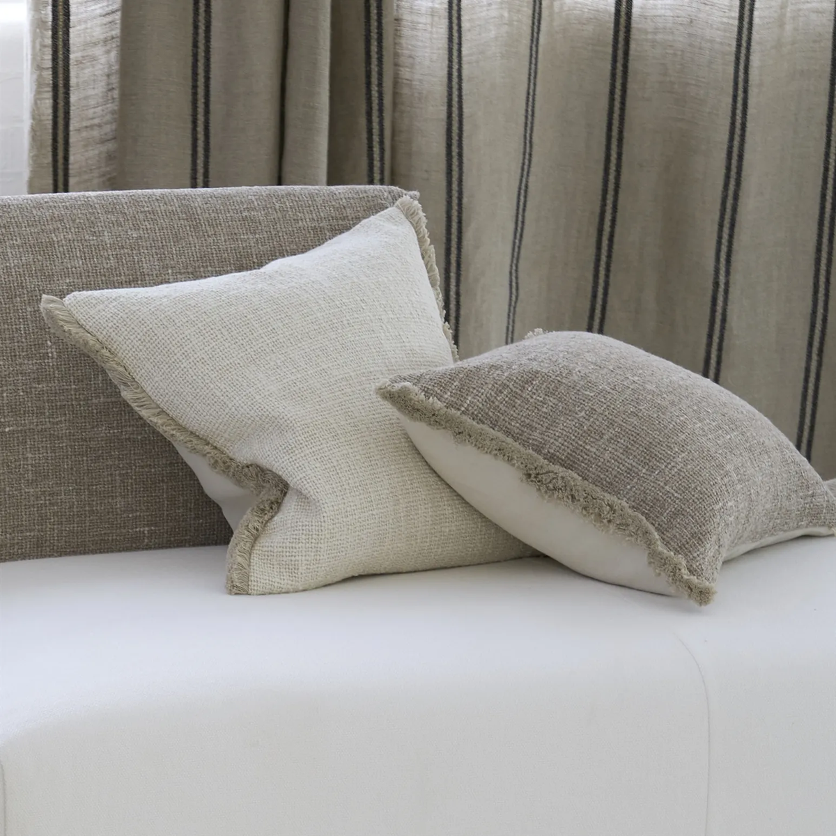 Ivory and sand boucle cushion with fringe 