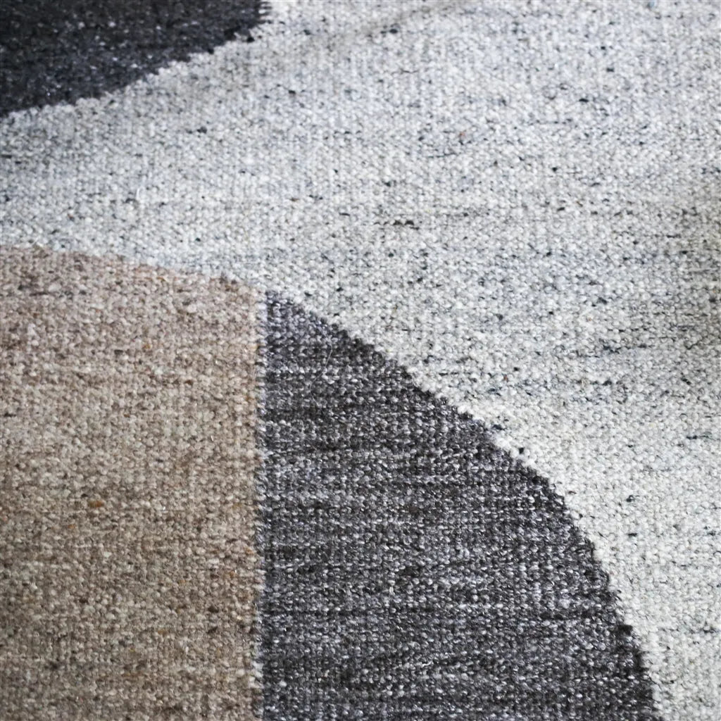 Neutral abstract geometric rug in ivory, taupe and beige with soft curved shapes, modern handwoven area rug.