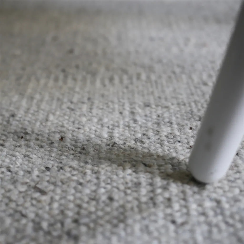 Neutral abstract geometric rug in ivory, taupe and beige with soft curved shapes, modern handwoven area rug.