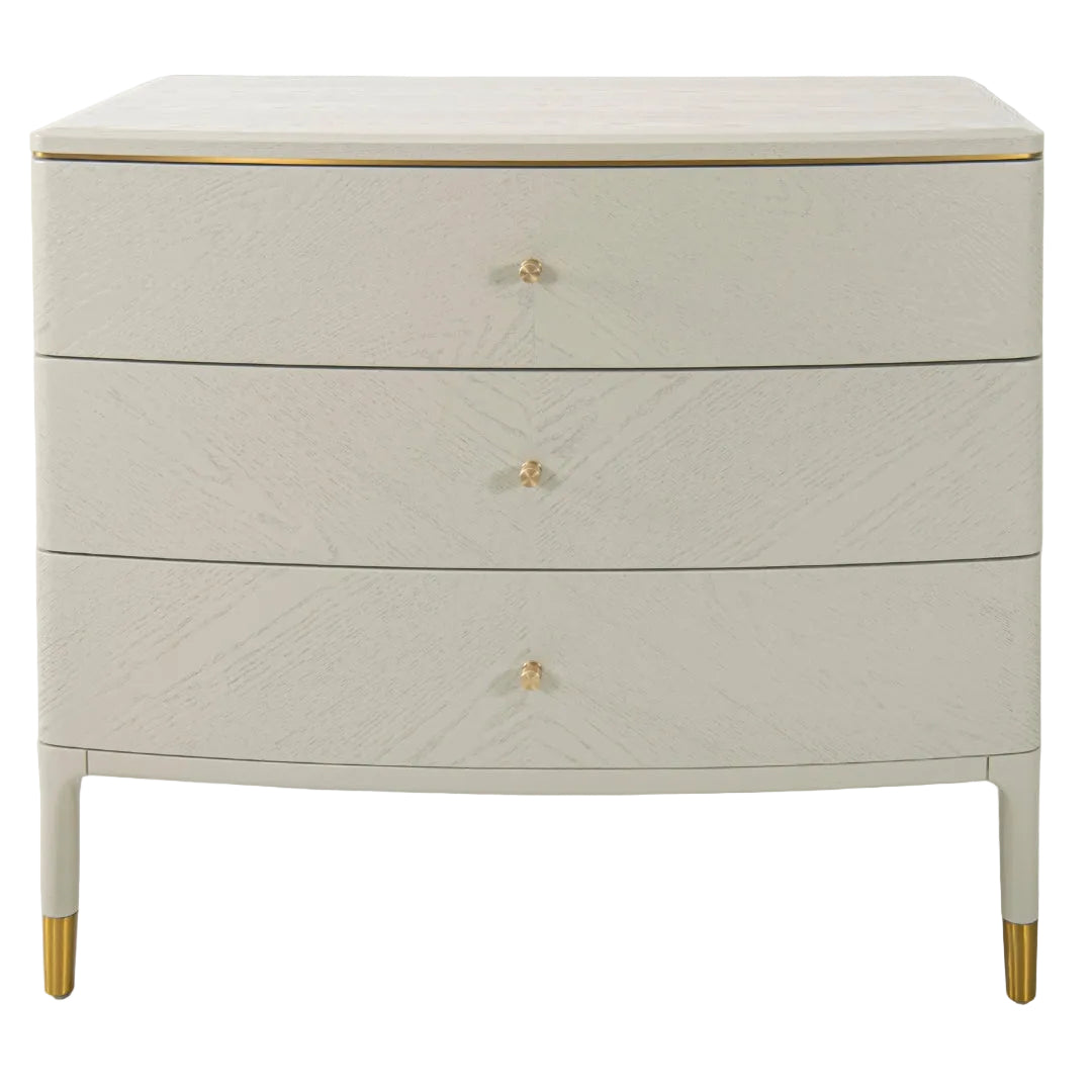 Off white three drawer chest with curved front and gold accents