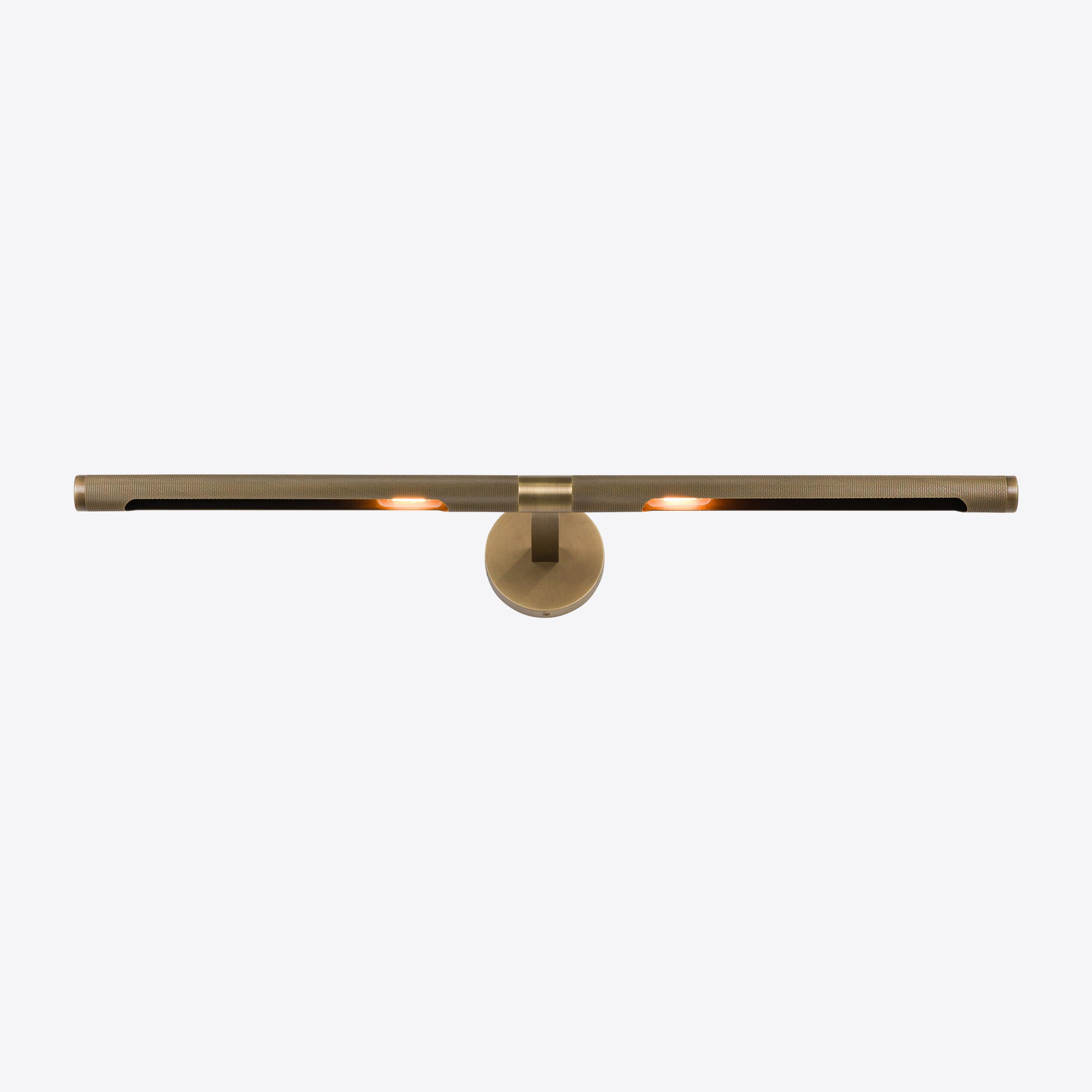 Modern brushed brass LED picture light with slim horizontal bar for illuminating artwork or mirrors.