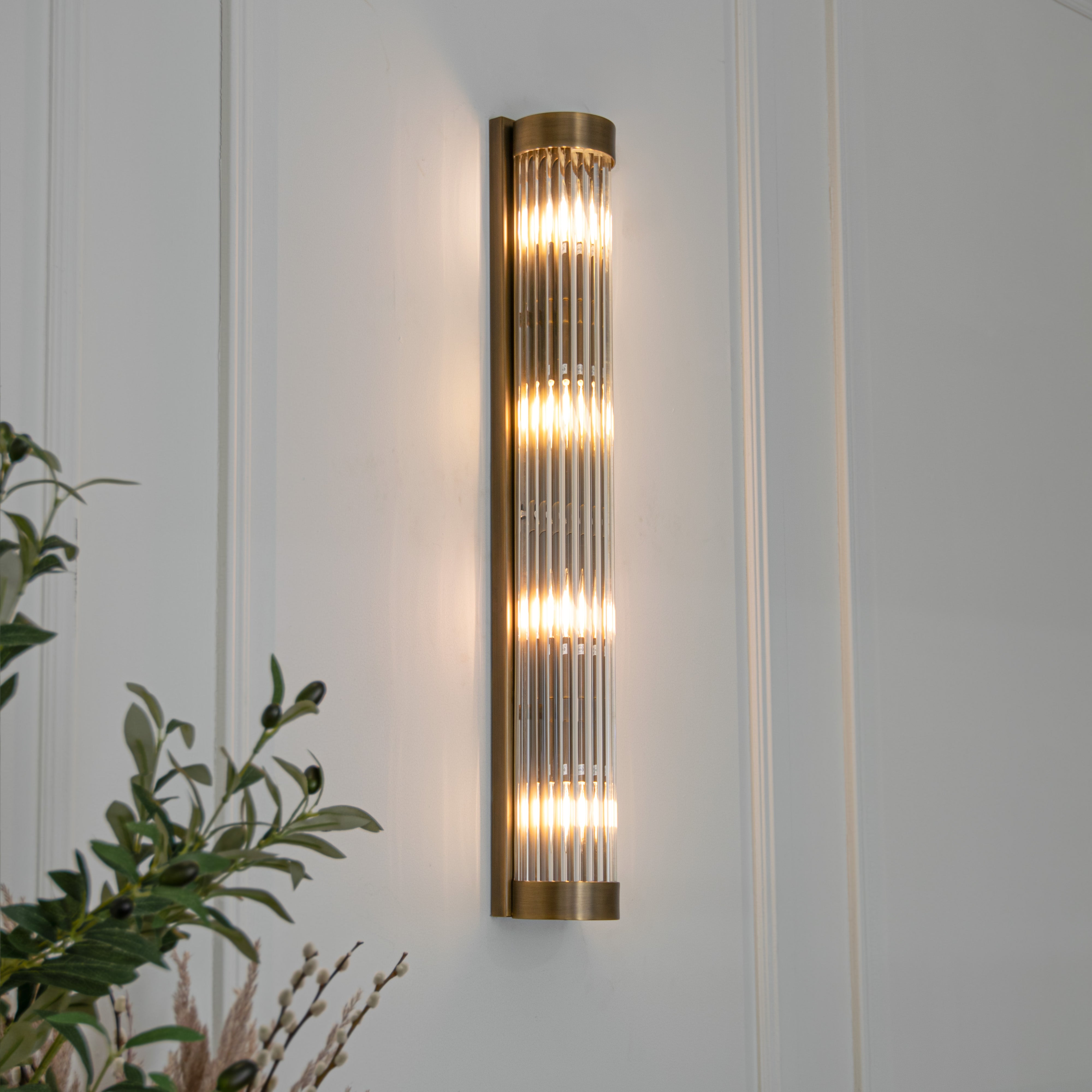 Nasir_long_wall_light with glass and bronze
