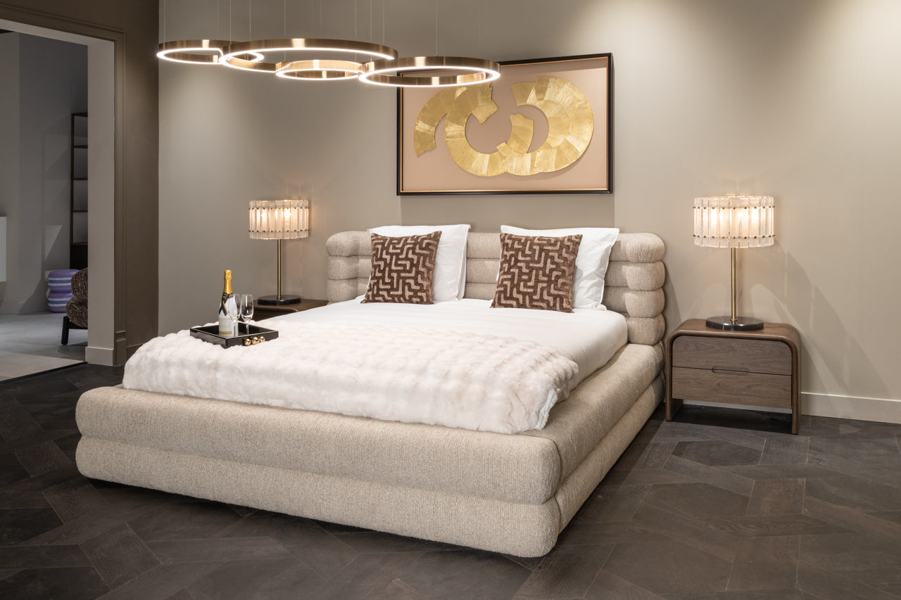 Beige upholstered storage bed with padded headboard and lift-up ottoman base