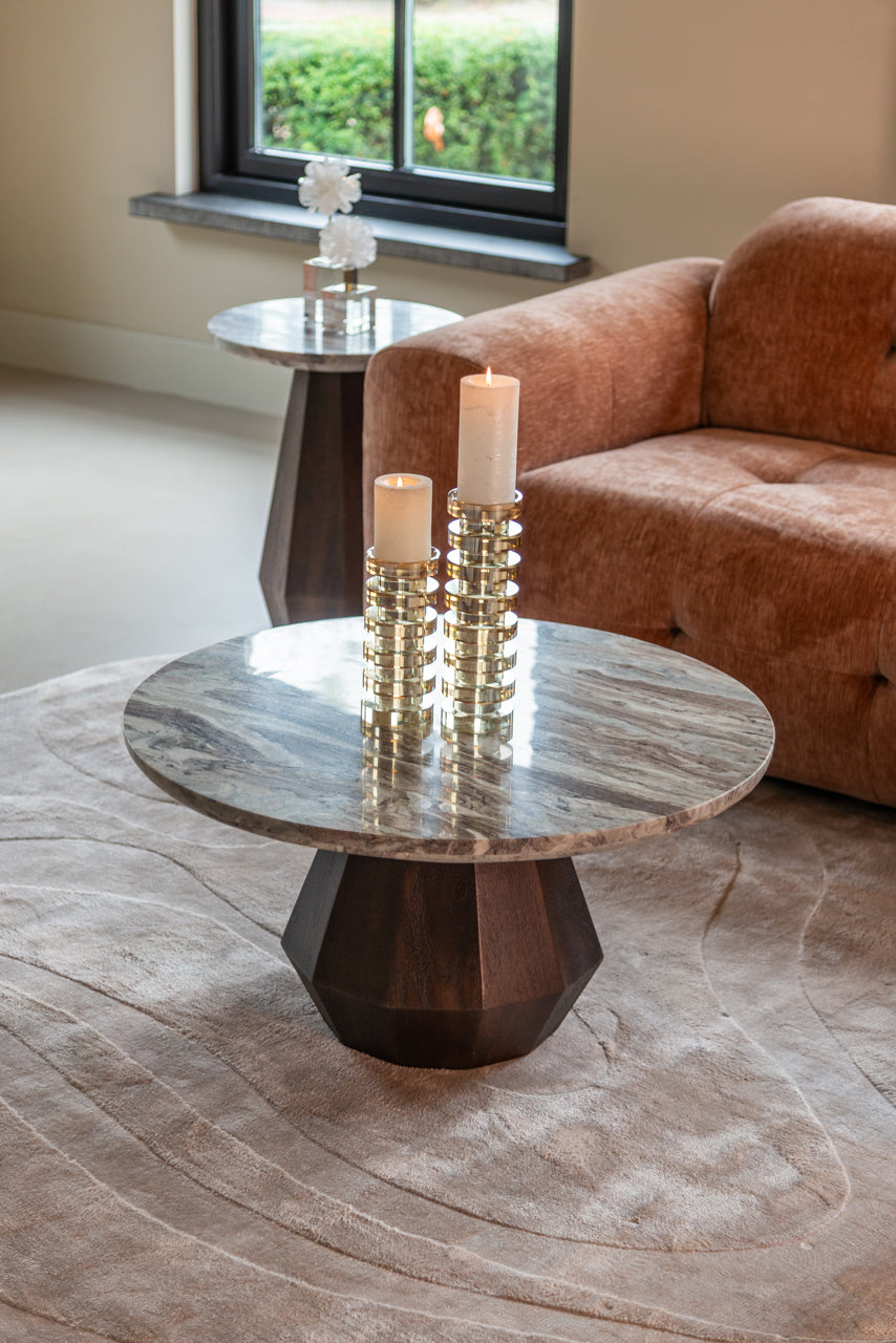 Round marble coffee table with dark mango wood base, modern sculptural design