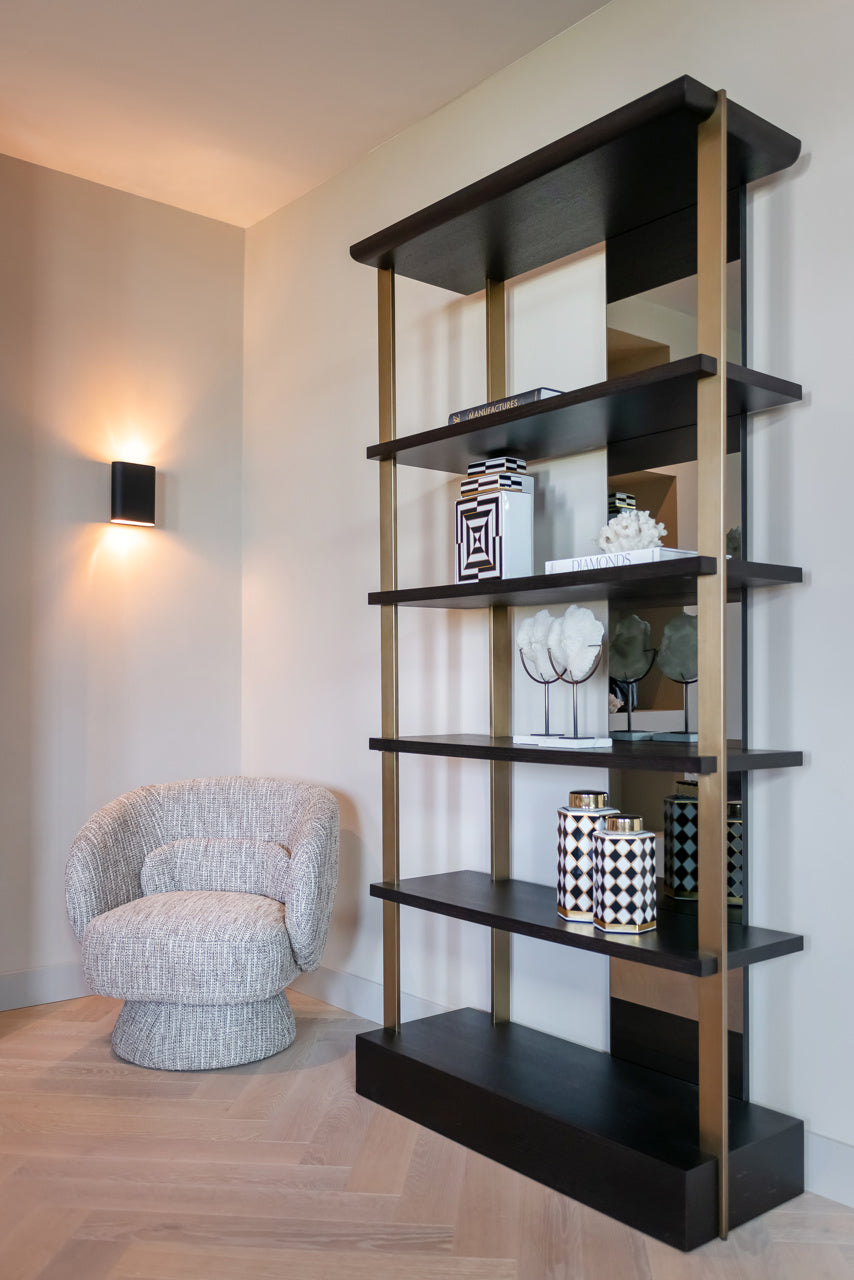 Modern wall shelving unit with mirror back gold frame and dark wood shelves