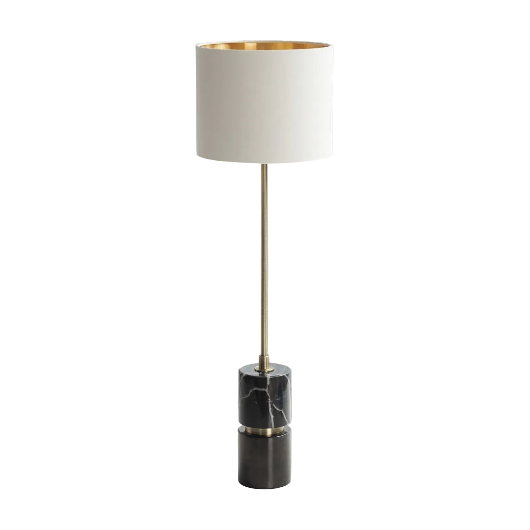Black marble table lamp with antique brass stem and cream shade with gold lining