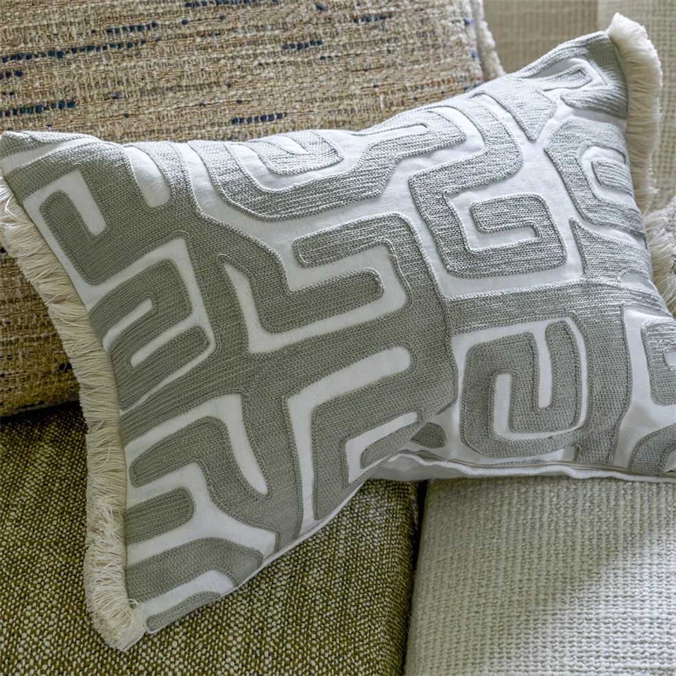 Sepia geometric embroidered cushion with fringe trim.