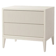 Wide grey bedside table with fluted drawer fronts and tapered legs