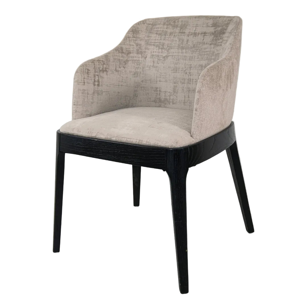 Contemporary dining chair with padded seat and tapered legs