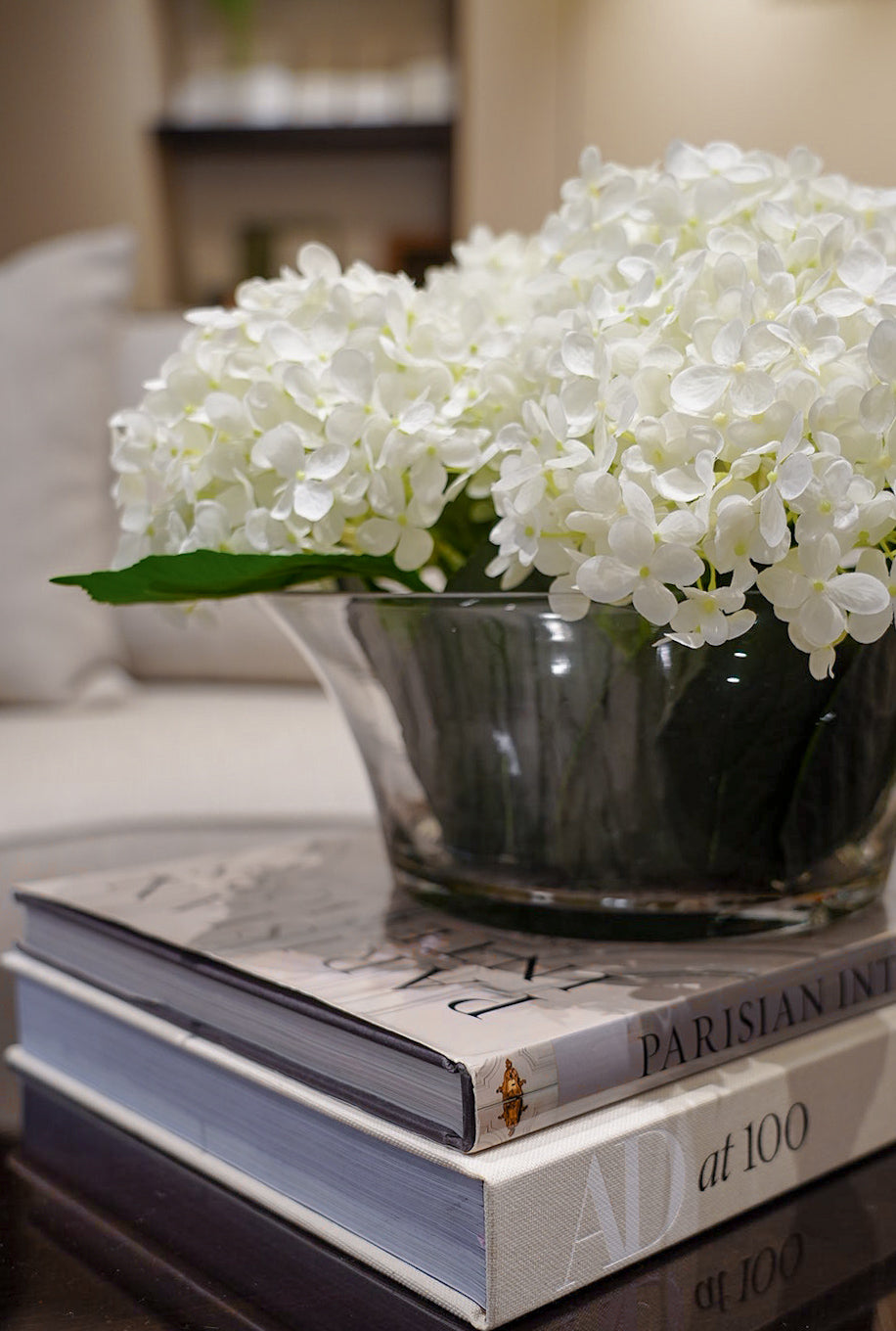 White hydrangeas in low glass bowl 